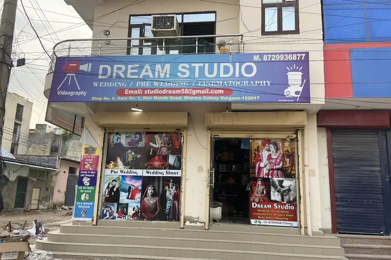 The blue Dream Studio signboard above the shop on Shiv Mandir Road.